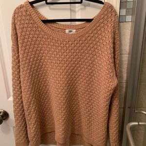 Beige knit sweater.